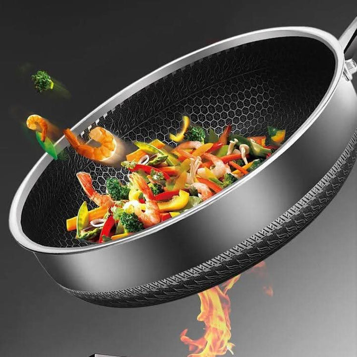 Induction compatible stainless steel cooking pan for superior, even heat. A durable kitchen essential for home or pro.