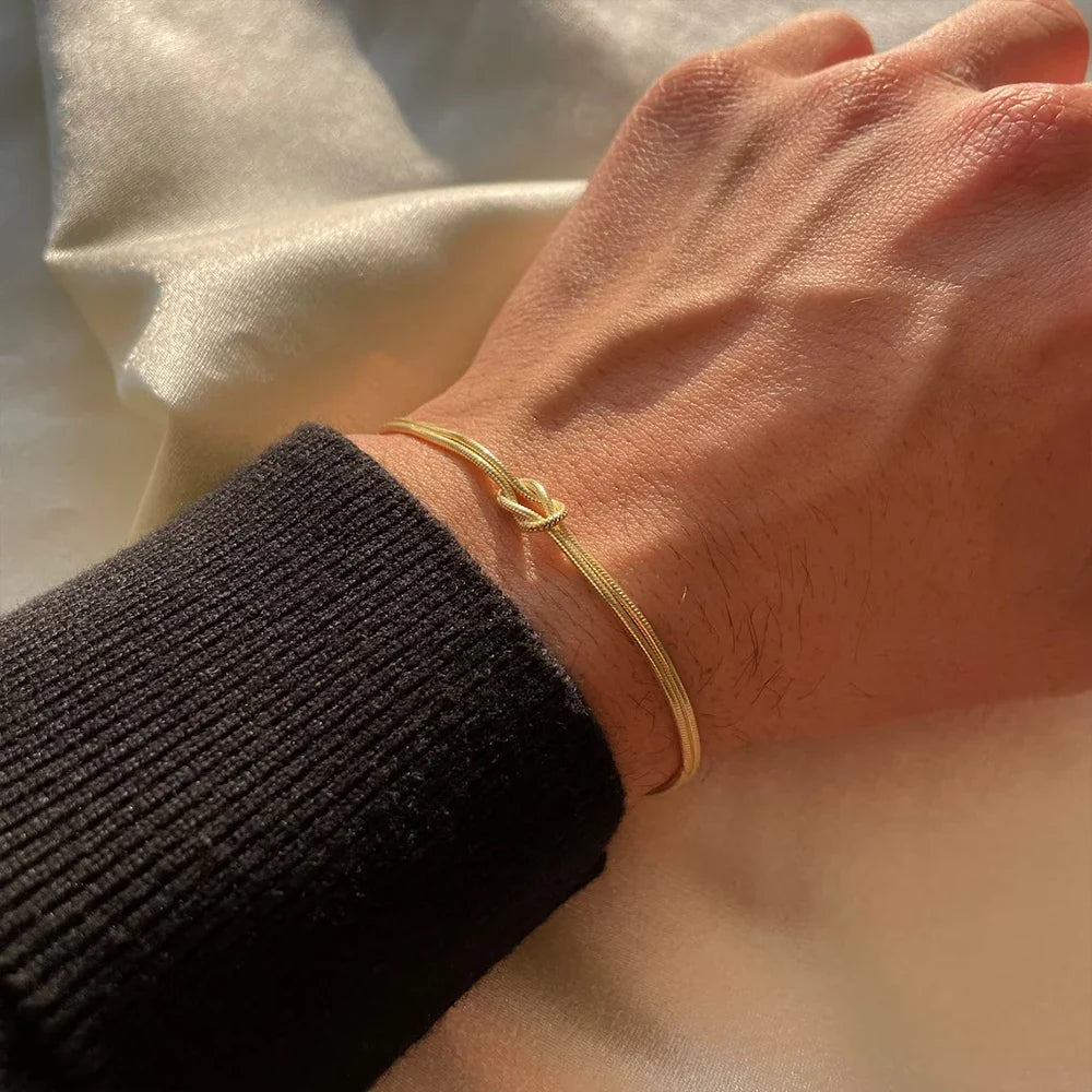Unisex Endless Knot bracelet, minimalist stainless steel design. Perfect tarnish-free jewelry.