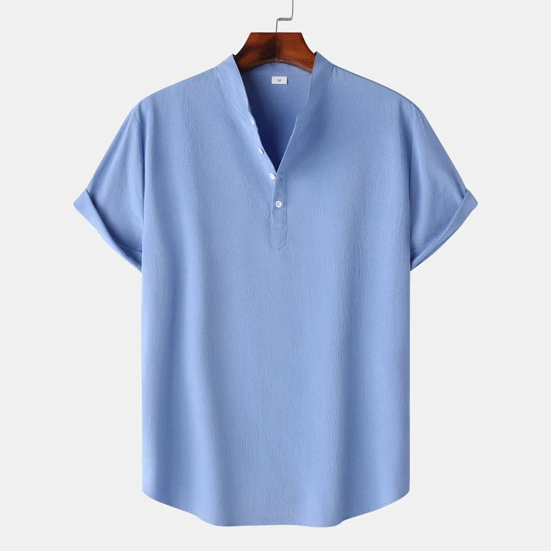 Stylish man wearing a natural tone long sleeve henley shirt, showcasing its casual and versatile appeal.
