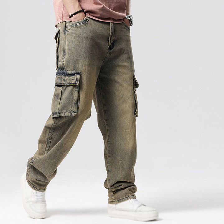 Man wearing relaxed fit blue utility cargo jeans, ideal for casual, comfortable everyday style.