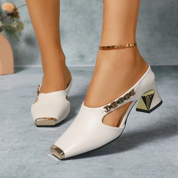 Chic women's dress heels with a striking metal pointed toe, ideal for making a fashion statement.