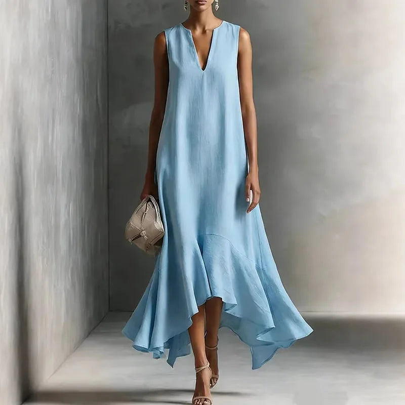 Women's flowy V-neck sundress with a comfortable, effortless silhouette and ruffle hem. Ideal for warm summer days.