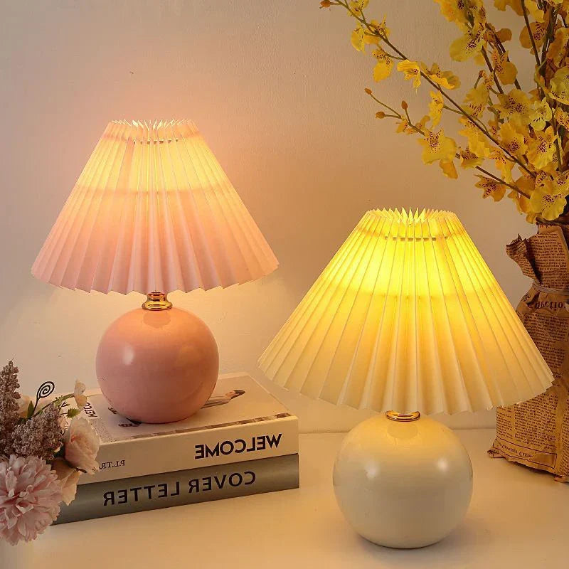 Energy-efficient LED pleated table lamp providing ambient light for modern nordic home decor.