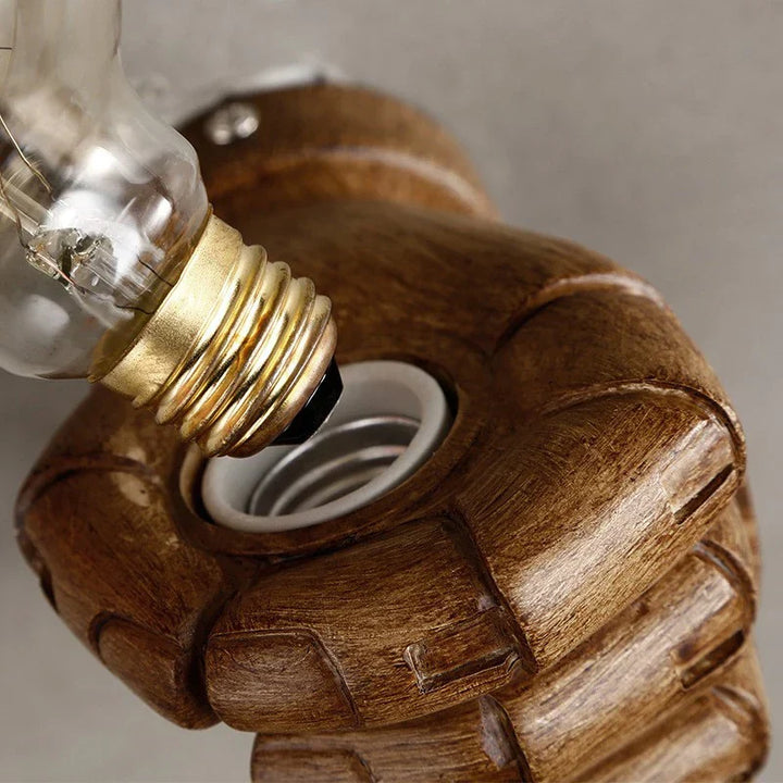 Sculpted fist wall lamp. Modern artistic lighting solution for creative home and commercial environments.