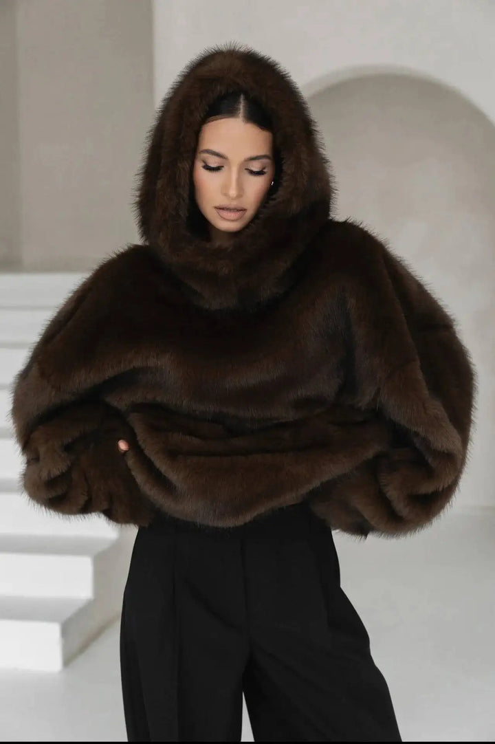 Cozy women's oversized hoodie with drop shoulder, offering ultimate comfort & winter warmth. Soft loungewear pullover.