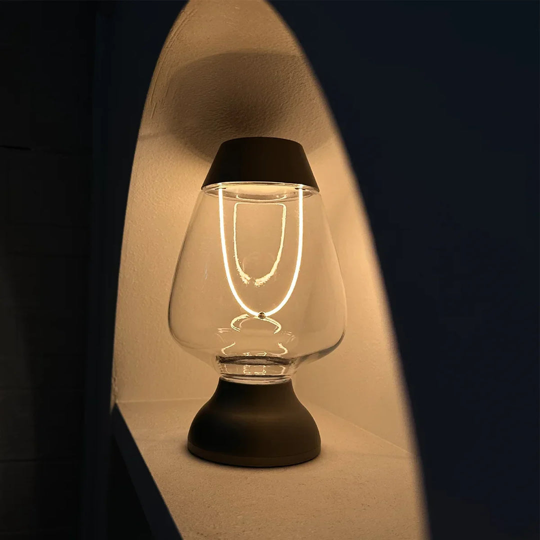 Warm white dimmable LED table lamp, creating cozy ambient light for relaxing modern home spaces.