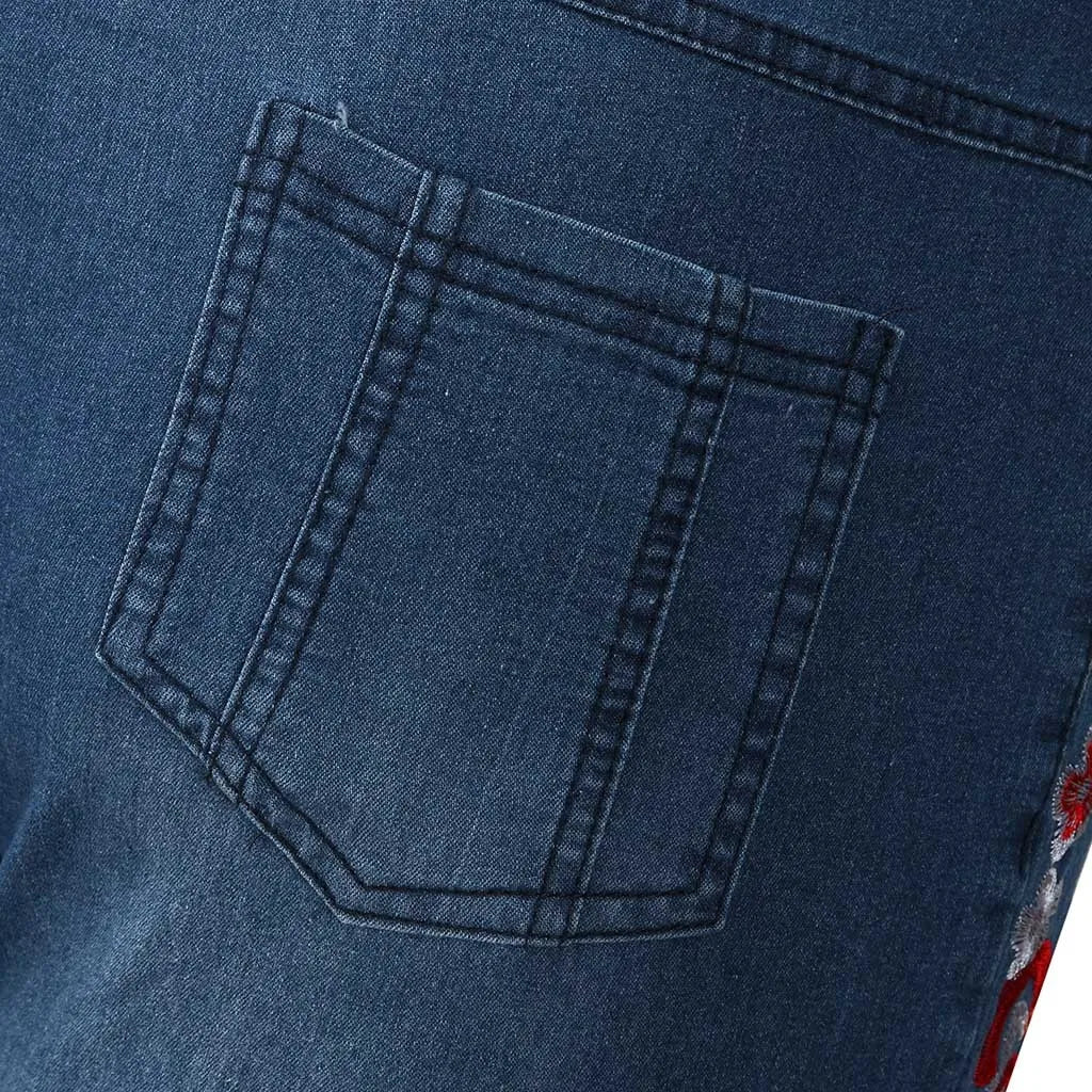 Close-up of classic women's 90s vintage high-waist blue denim jeans, perfect for a throwback retro style.