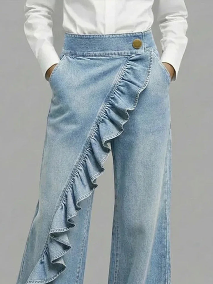Back view of women's high-rise wide leg jeans. Flattering, comfortable fit with chic ruffle detail. Casual wear.