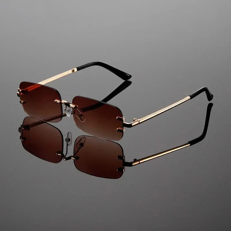 Stylish lightweight rimless sunglasses for men & women, featuring a sleek modern design and comfortable sun protection.