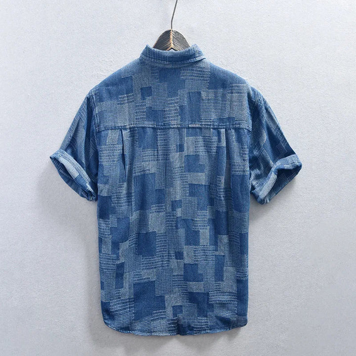 Black men's stylish button-down shirt with multi-pockets, ideal for versatile everyday fashion. Long sleeve.
