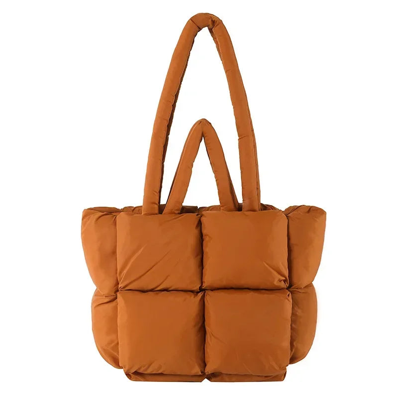 Stylish women's puffer tote bag in a chic color, ideal for daily use.