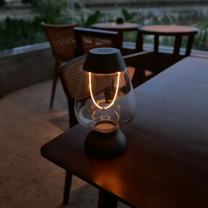 Elegant modern cordless LED table lamp, offering dimmable warm white ambient lighting for sophisticated decor.