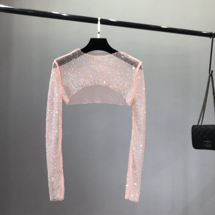 Elegant women's party net top, glittering and glamorous for a night out. Effortless sparkle clubwear.