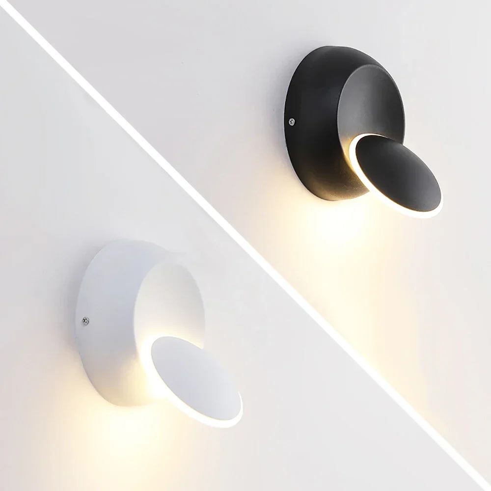 Modern black adjustable LED wall lamp, flexible lighting solution for contemporary home decor, energy efficient.