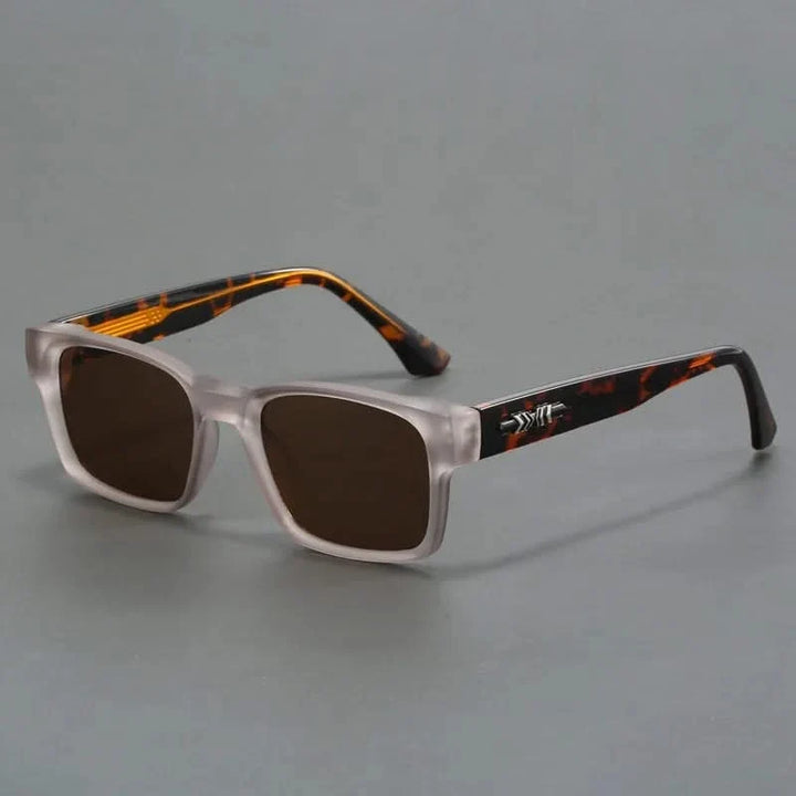Close-up of bold black square sunglasses, highlighting anti-reflective UV protection lenses.