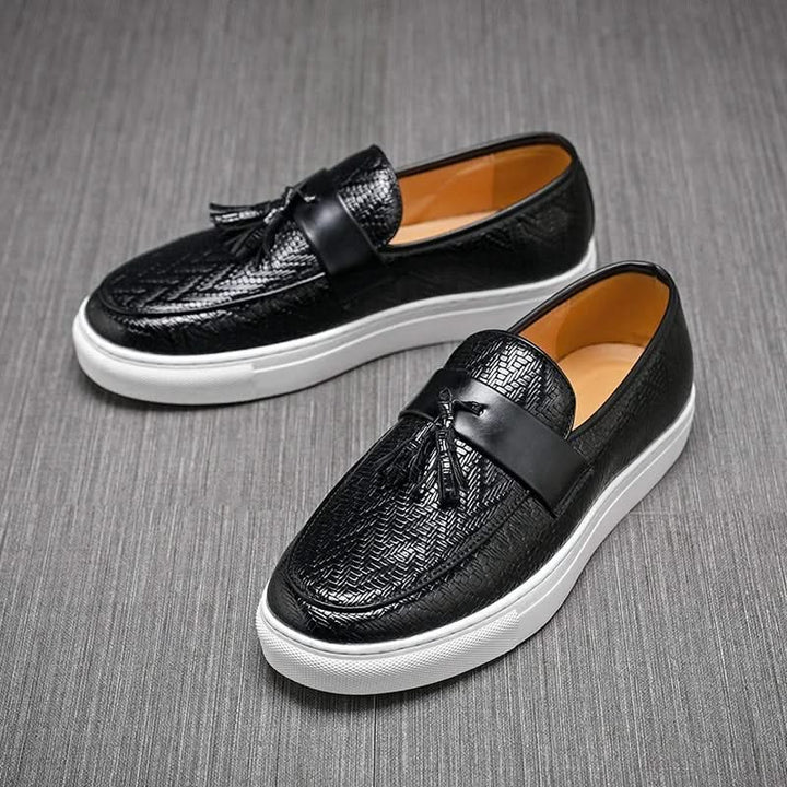Pair of men's Marcelli tassel loafers, ready for comfortable slip-on wear. Essential casual & dress shoes.