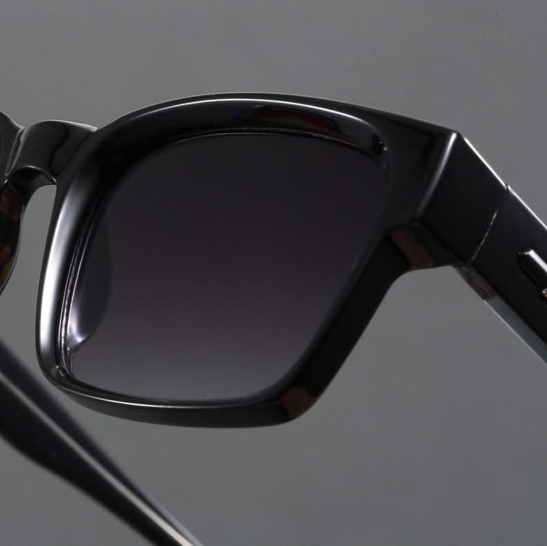 Dynamic shot of unisex square frame sunglasses, showcasing UV protection and contemporary style.
