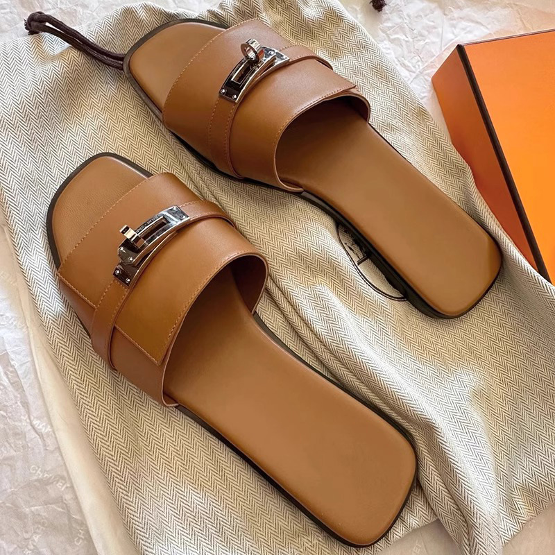 Elegant women's square-toe leather slides, chic slip-on sandals with sleek design for summer comfort.