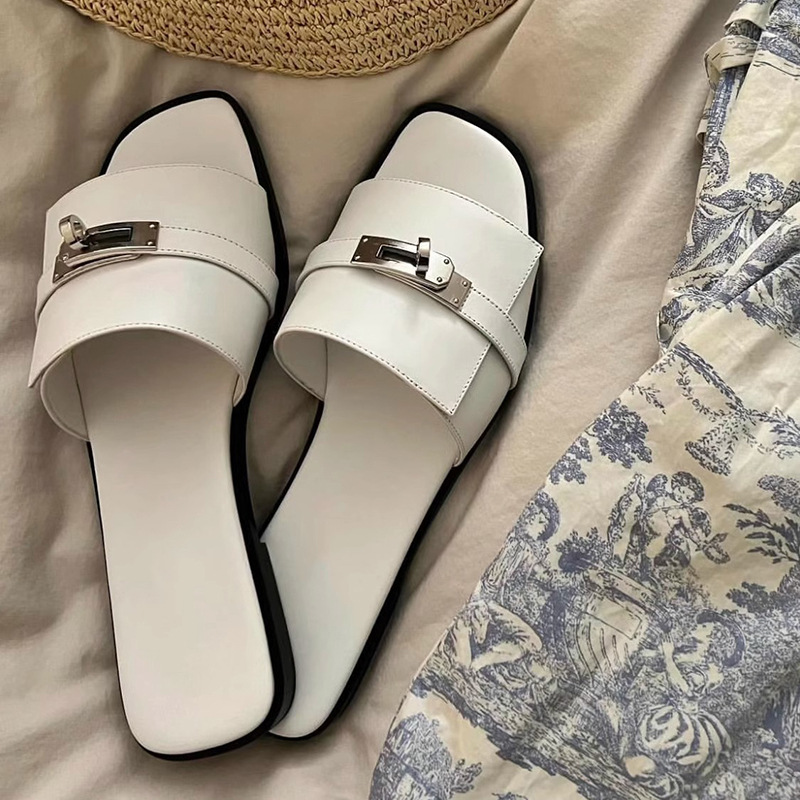 Chic women's square-toe leather slides with metallic buckle. Elegant and comfortable slip-on summer sandals.