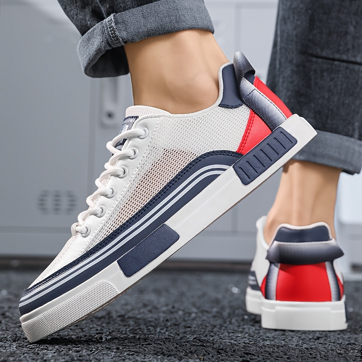 Men's white athletic sneakers, offering dynamic comfort and sporty flair.