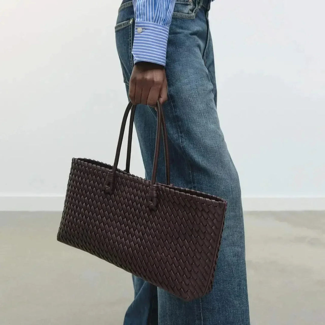 Textured woven leather women's handbag, a sophisticated purse for any fashion-conscious woman.
