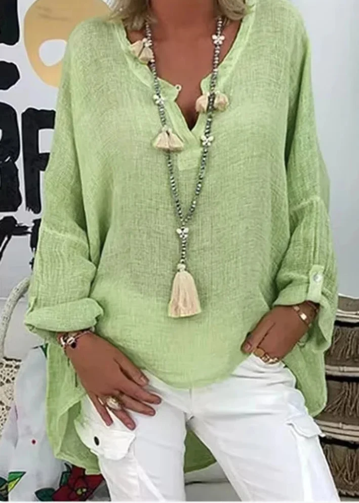 Effortless chic women's oversized long sleeve top, a versatile and comfortable modern shirt.