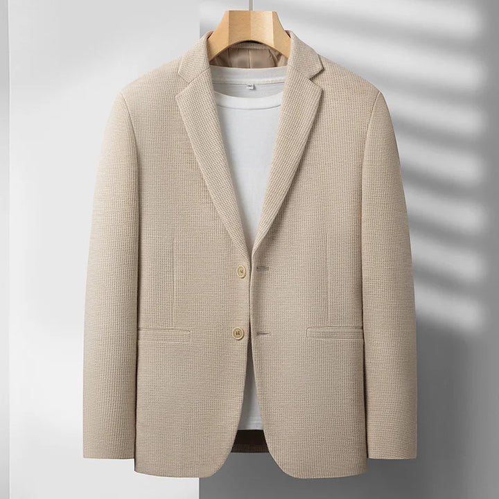 Stylish men's gray structured blazer, ideal for business meetings or elegant smart casual events.