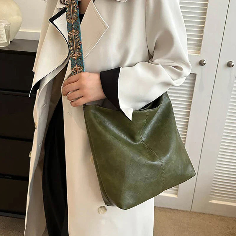 Bohemian shoulder bag for women with unique patterned guitar strap. Stylish synthetic leather.