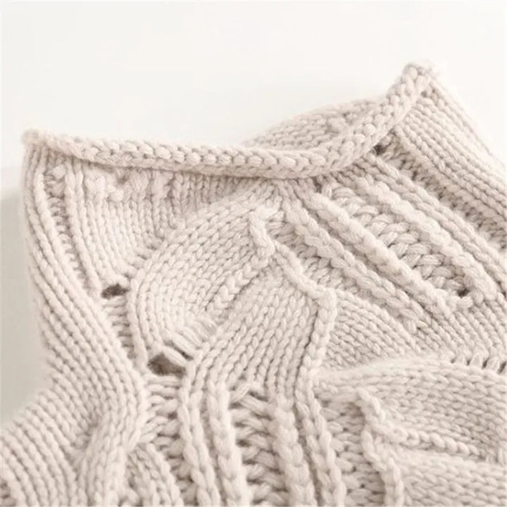 Elegant women's Aurora wavy knit turtleneck sweater, ideal for warm layering in fall and winter fashion outfits.
