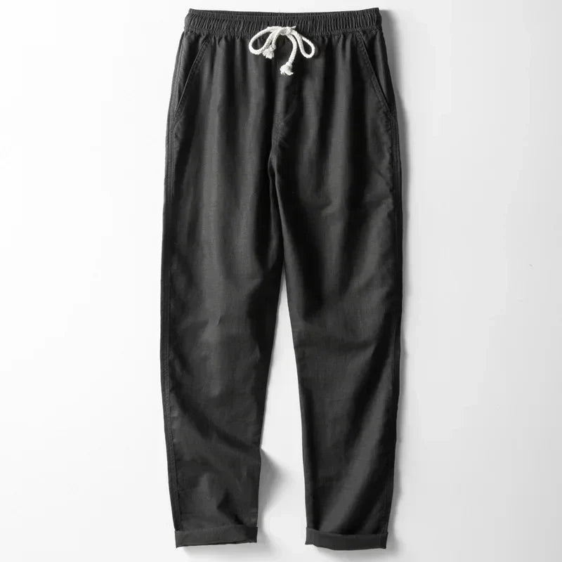 Comfortable unisex lightweight linen pants with elastic waist, designed for ultimate breathability and relaxed summer style.