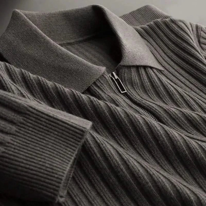 Model wearing a stylish men's long sleeve ribbed knit polo shirt. Cotton blend casual top, comfort fit.