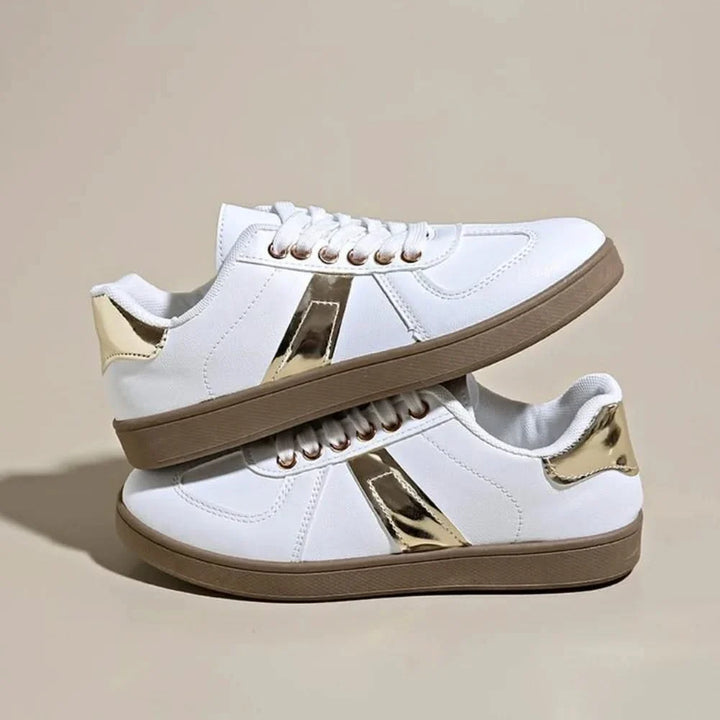 Elegant gold & black women's sneakers offering superior comfort for everyday style.