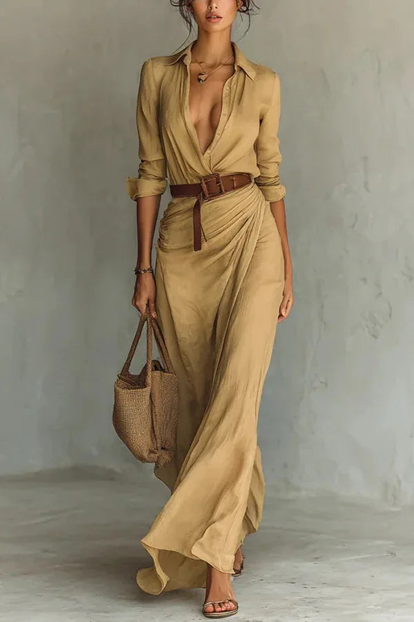 Women's elegant black wrap maxi dress with long sleeves and a flowing skirt, perfect for evening or casual wear.