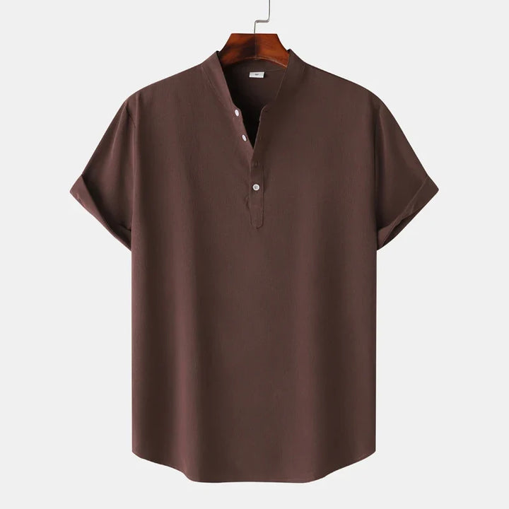 Front view of a comfortable men's natural tone henley shirt with long sleeves, ideal for casual style.