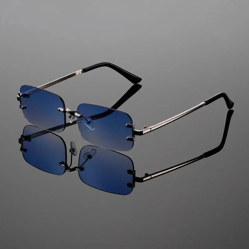Close-up of modern unisex rimless sunglasses, showcasing the anti-glare lenses and elegant, lightweight frame.