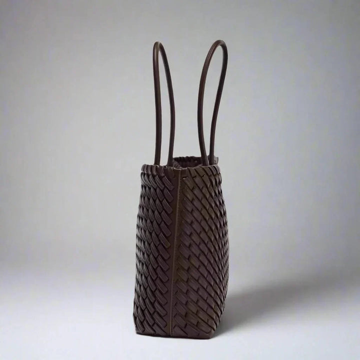 Handcrafted woven leather handbag for women, an elegant and durable everyday accessory.