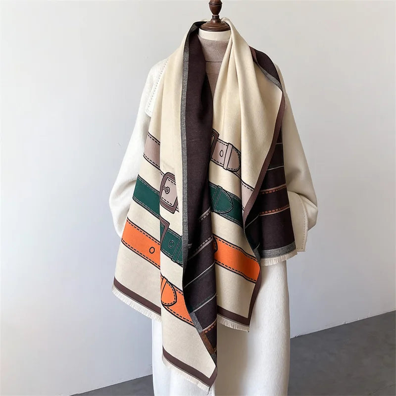 Vibrant orange cashmere blend scarf featuring a unique belt buckle pattern, a warm and elegant unisex accessory.