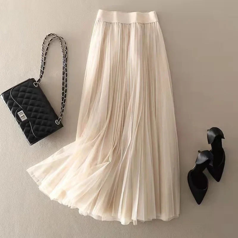 Stylish women's pleated A-line skirt, flowy midi length, high-waisted, a timeless piece for spring & summer fashion.
