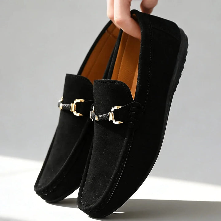 Classic men's slip-on footwear: loafers with a refined buckle, blending comfort and timeless style.