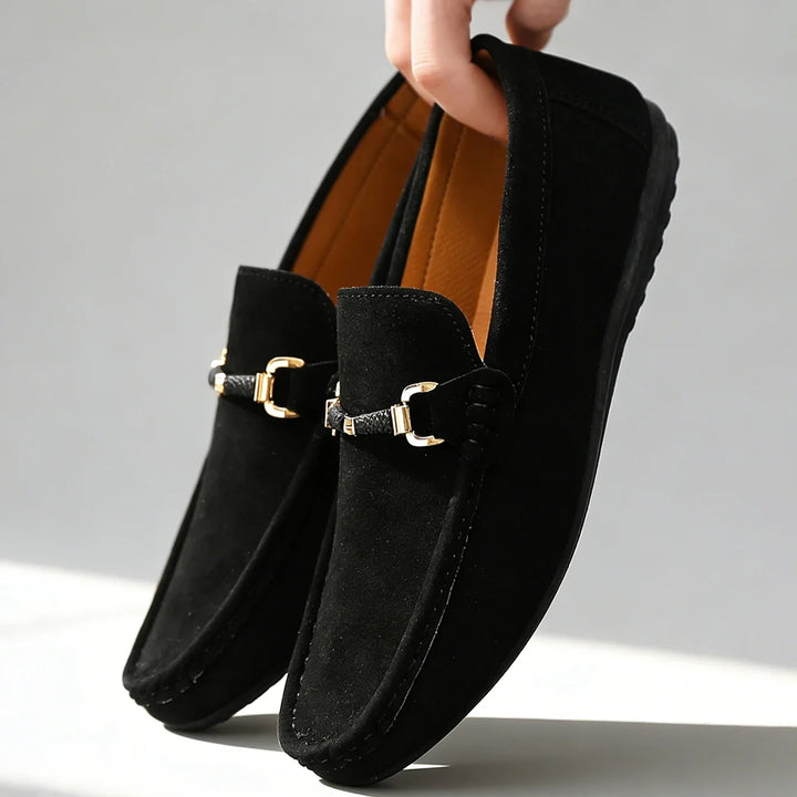 Classic men's slip-on loafers with metal buckle, perfect for stylish everyday wear. Comfortable footwear.
