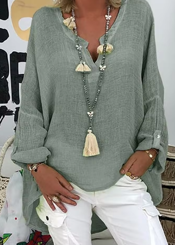 Relaxed fit women's oversized blouse with long sleeves, offering comfortable and stylish everyday fashion.
