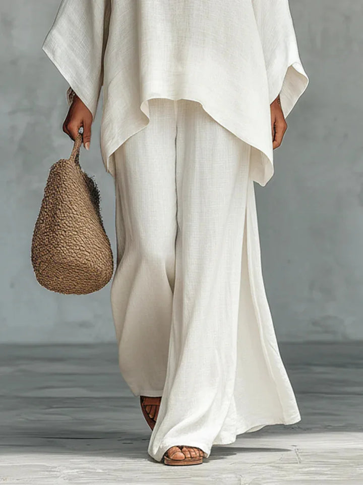 Asymmetrical top and wide-leg linen blend pants. Relaxed fit women's two-piece set for casual fashion.
