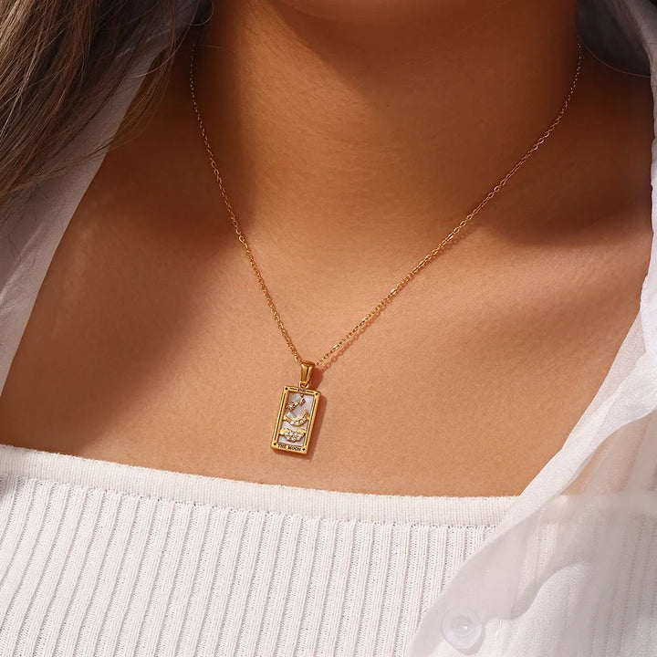 Stylish women's tarot necklace, gold-toned spiritual jewelry, unique mystical pendant gift.