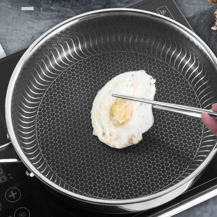 Heavy-duty stainless steel frying pan designed for even cooking. Professional-grade, oven-safe and induction ready.