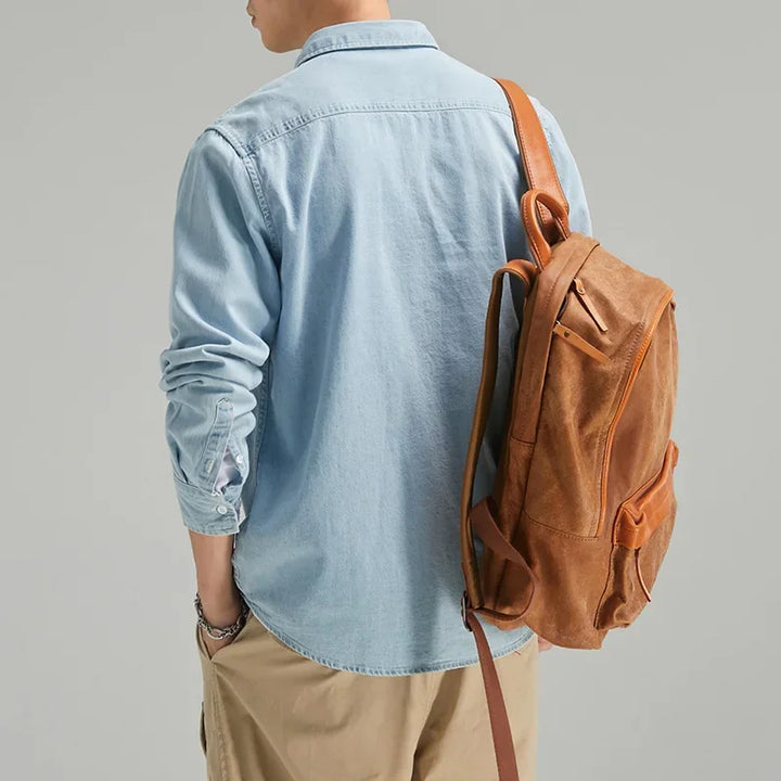 Modern men's blue denim long-sleeve shirt. Classic button-down for casual, versatile style.
