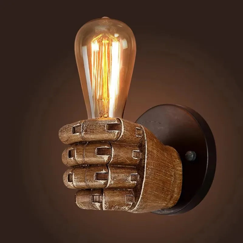 Artistic sculpted fist wall lamp for striking home & business lighting. Resin construction, unique design.