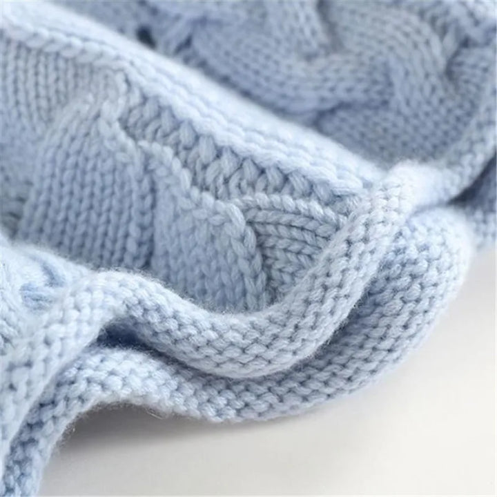 Stylish women's Aurora wavy knit turtleneck sweater for a warm, cozy feel. Essential knitwear for winter fashion.