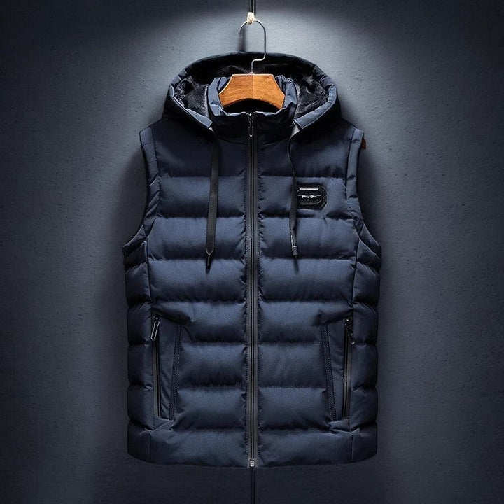 Stylish men's hooded puffer vest, lightweight & warm. Essential fall and winter outerwear for casual layering.