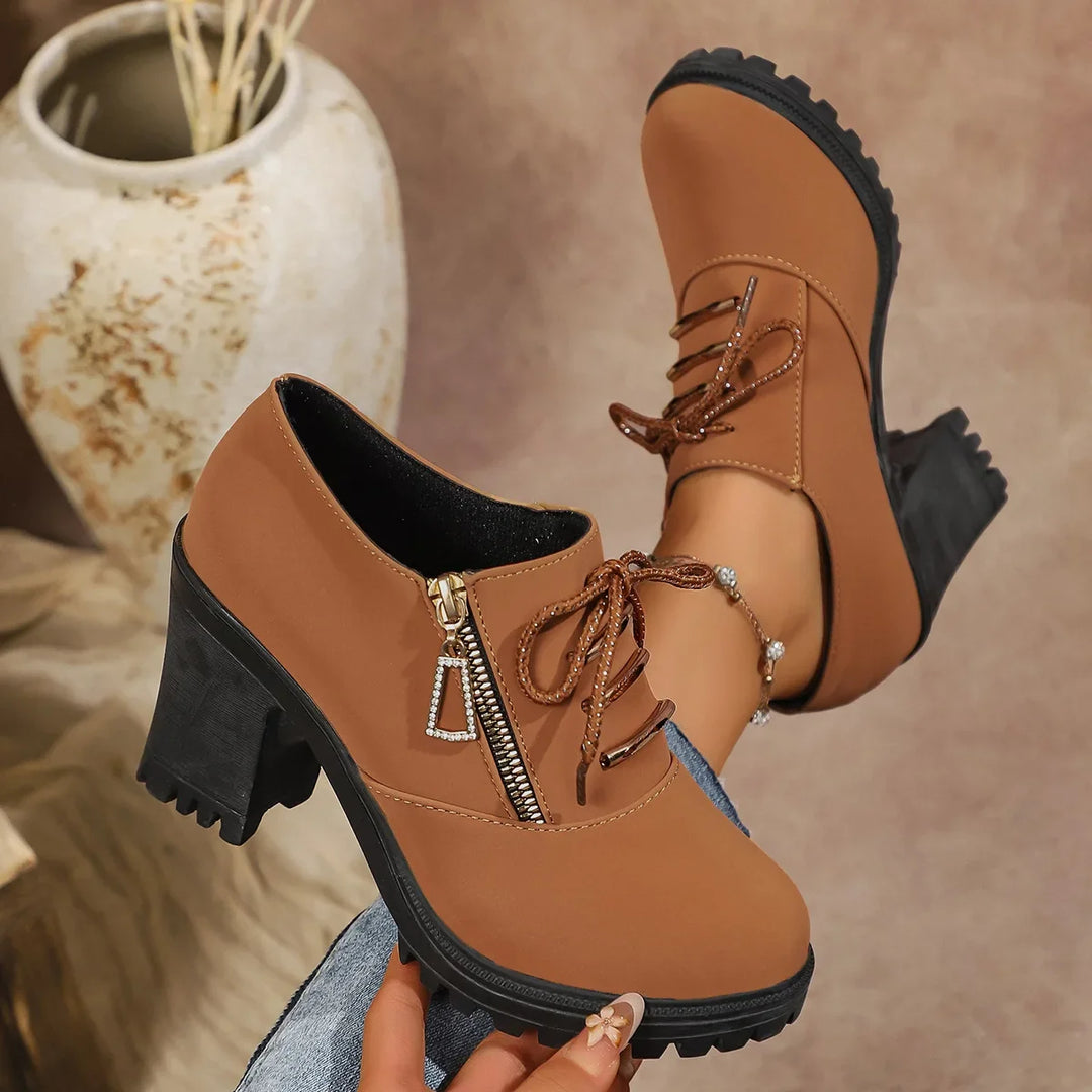 Women's ankle-height lace-up block heels, designed for comfort and a sophisticated, modern look.