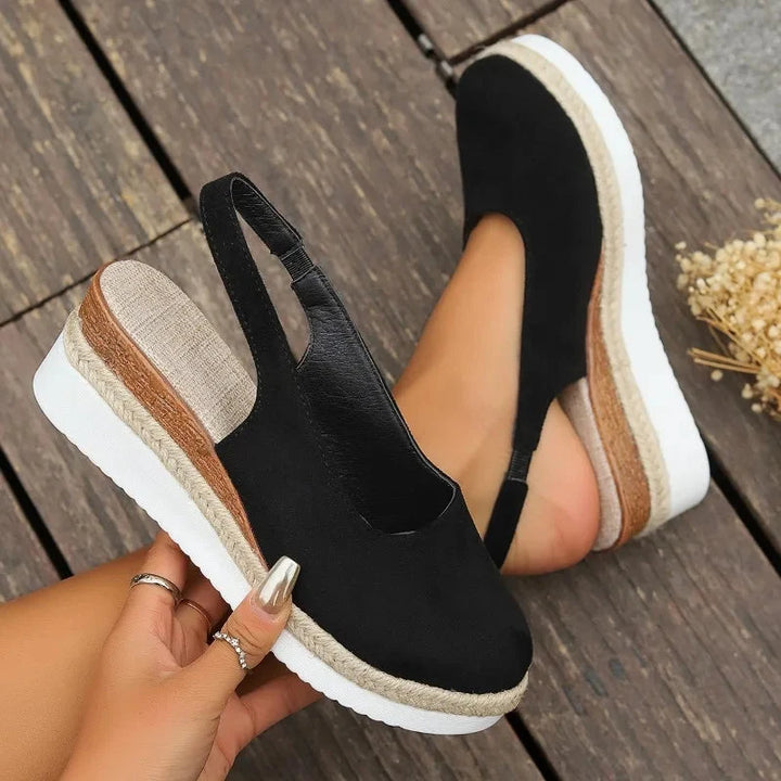 Close-up of women's orthopedic sandals, showcasing posture support & comfortable design. Ideal for foot health.